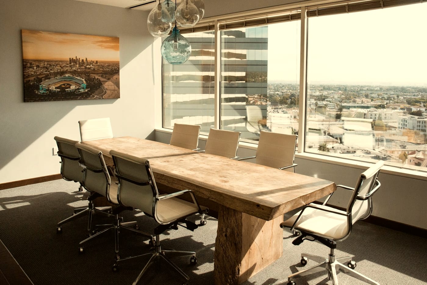A boardroom table set for an investor meeting